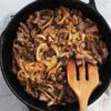 bistec encebollado